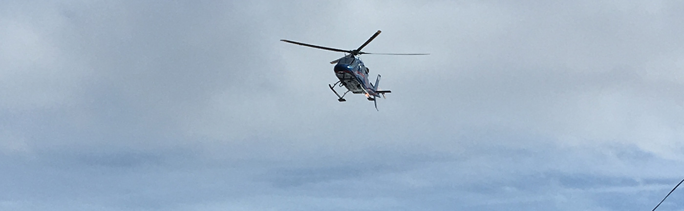 helicopter in a cloudy sky